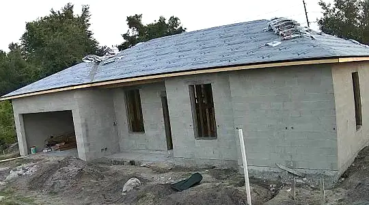 Block shell with roof dry-in on a Port Charlotte single-family build