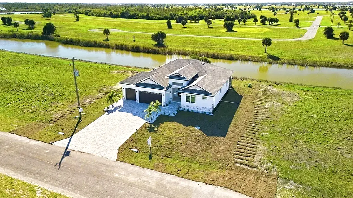 Aerial view of a finished Hivesta home on a pond lot