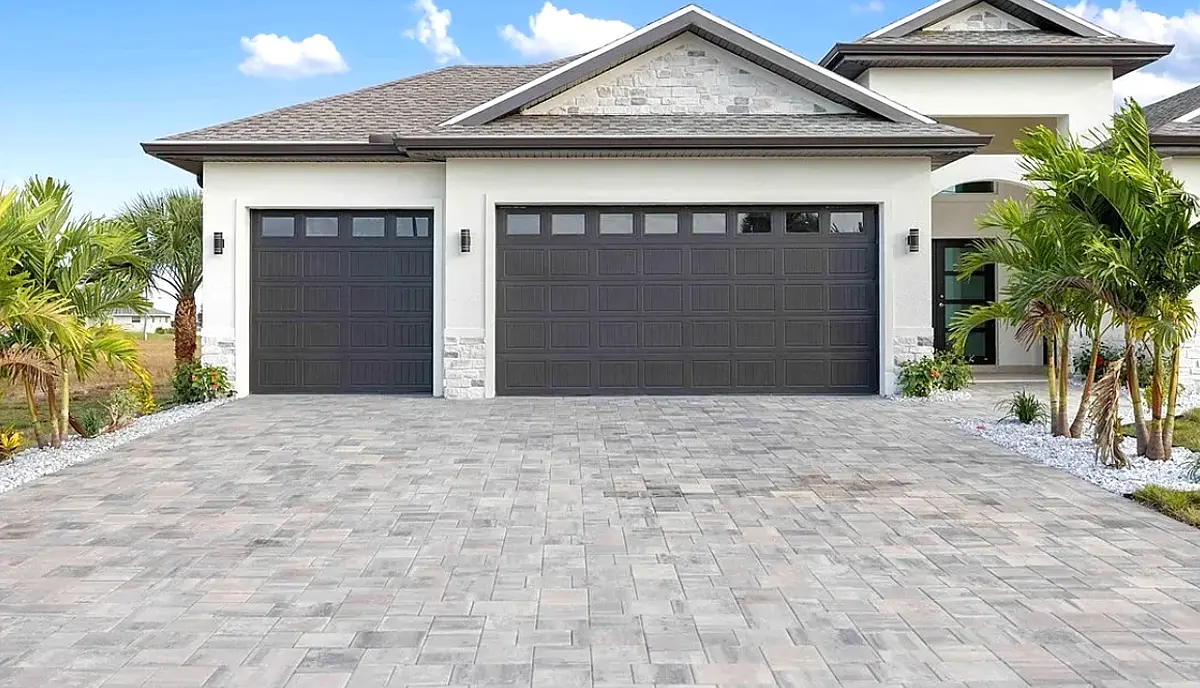 Finished three-car-garage home with paver driveway in Port Charlotte