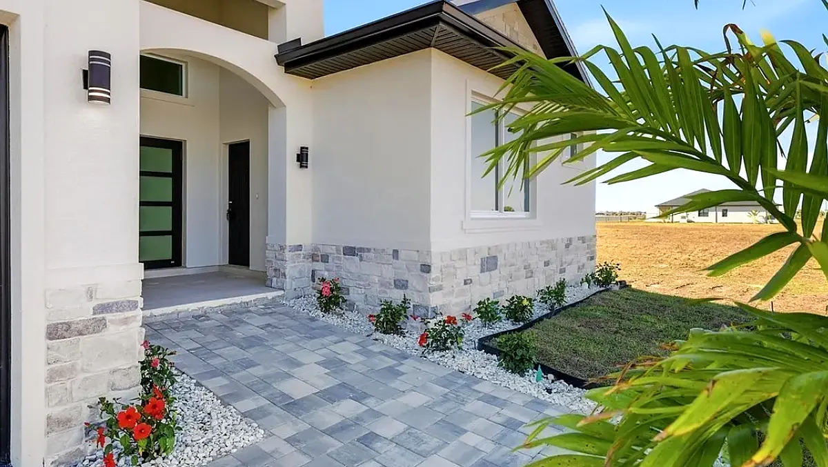 Front entry with stone veneer and paver walkway