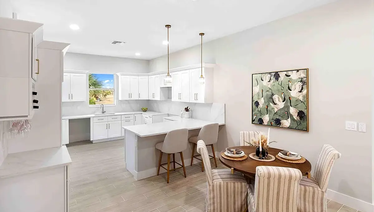 Kitchen island with pendant lights and dining area