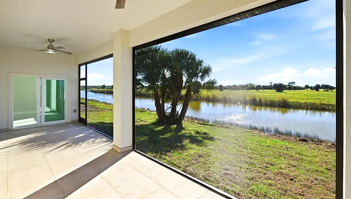 Screened lanai opening onto a pond view